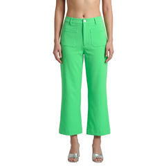 Woman wearing Nela Color Series Spring Green high-waist flared pants with Nela print sleeveless top — bold made-to-order fashion by Blissfully Brand