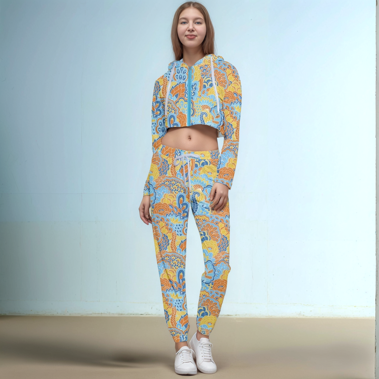 Retro paisley print two-piece loungewear set with cropped hoodie and joggers in yellow, orange and blue Floral Flower Power Pinsa pattern - Blissfully Brand