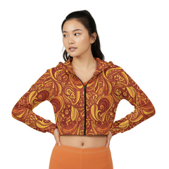 Safrana Print Cropped Hoodie in orange and yellow retro patterns, zipped up with hood, paired with matching orange leggings - Blissfully Brand
