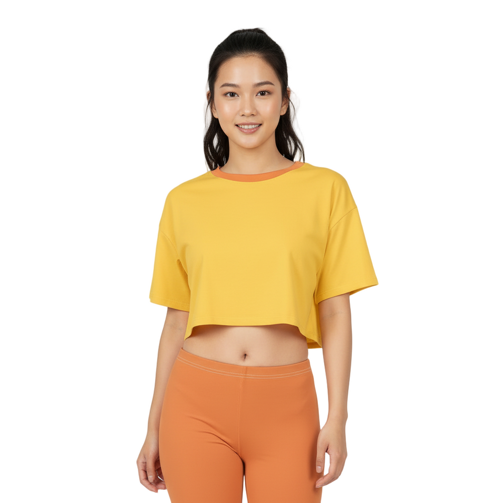 Safrana Solid Series 100% cotton cropped tee in Sunglow yellow, Drop Shoulders, paired with orange leggings - Blissfully Brand