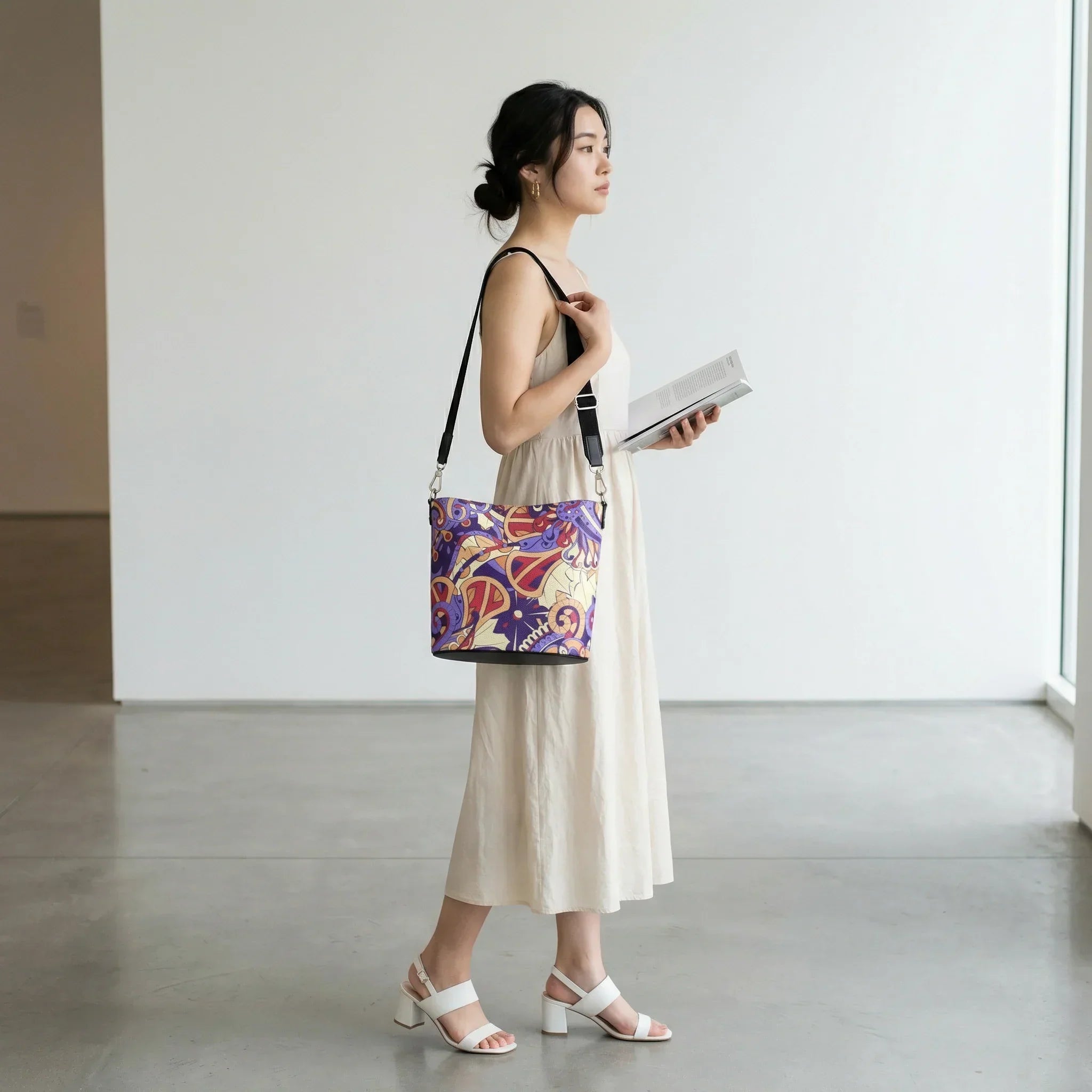 Sechie psychedelic print Nappa leather bucket bag in Blue Diamond violet, Crimson Red, and Peach Orange with nickel hardware and adjustable strap — London Bliss Collection by Blissfully Brand