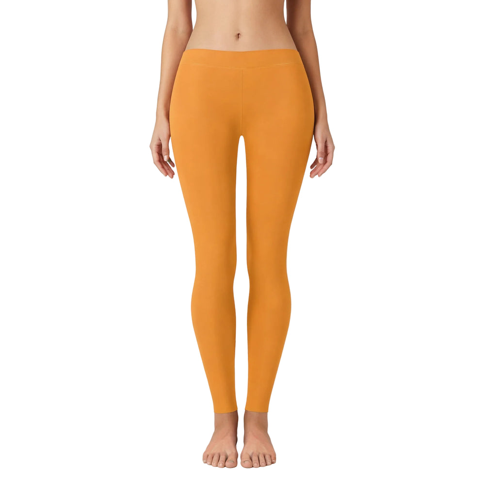 Shop our Core Series Essentials Tangerine Orange Leggings in a stunning tangerine color, featuring an elastic waistband, full-length cut, and low-waisted design. - Blissfully Brand