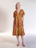 Ame dress by Blissfully Brand - vibrant orange and yellow ethnic print midi dress with V-neck.