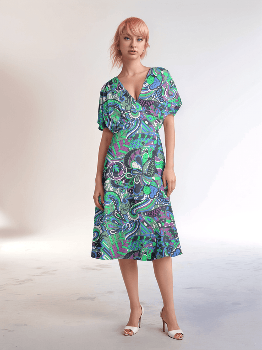 Bold and vibrant Nela dress by Blissfully Brand, featuring a retro chic design with a kaleidoscopic swirl of teal, purple, and green patterns, perfect for making a statement among bold, stylish dressers with a love for vintage-inspired flair.