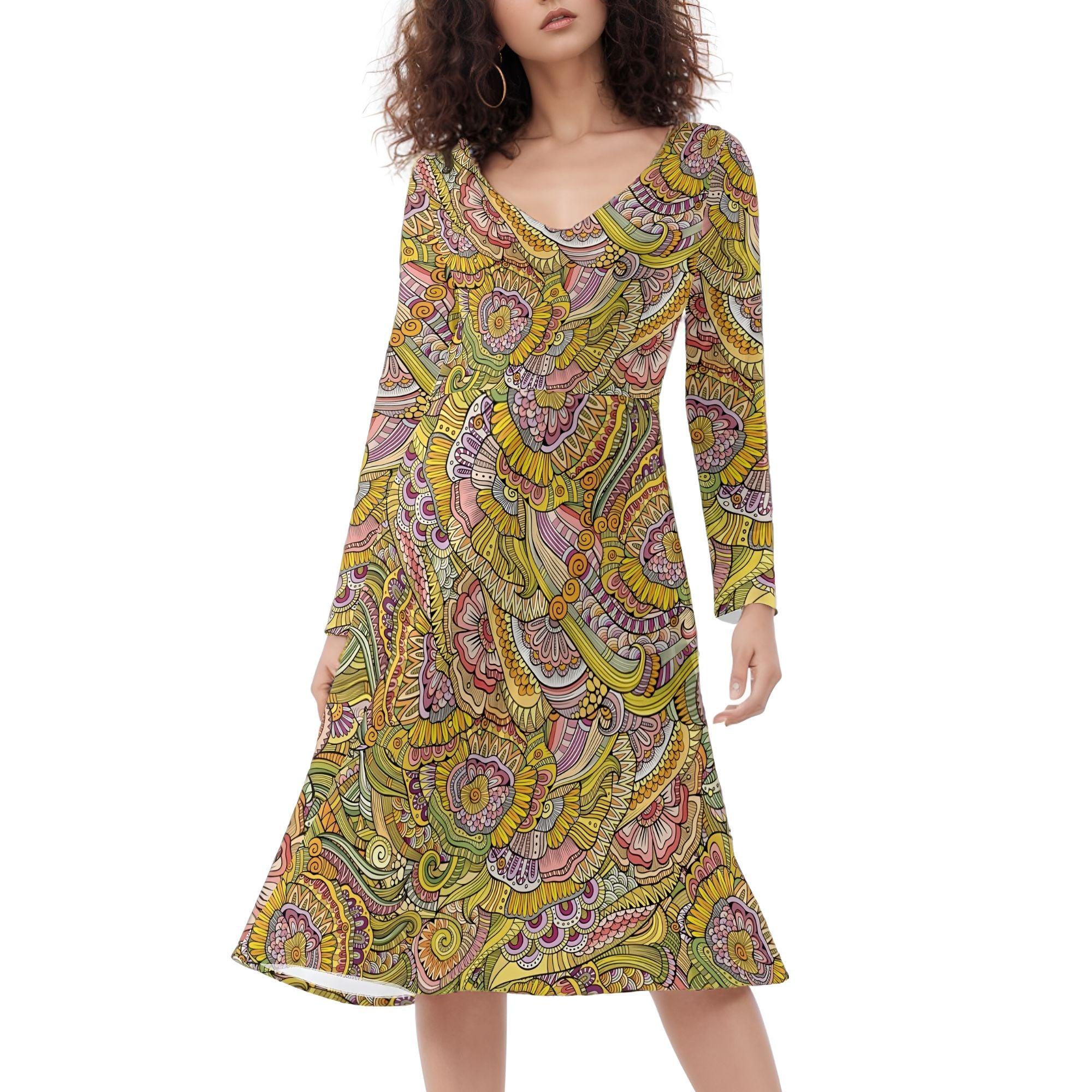 Bohemian-style knee-length dress with long sleeves and vibrant yellow, pink, and green paisley print