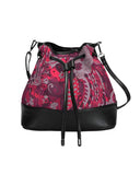 Stylish bucket bag with vibrant pink and red paisley pattern, black leather trim, drawstring closure, and adjustable shoulder strap. Designer handbag featuring unique floral print, spacious interior, and versatile crossbody design for fashionable everyday use