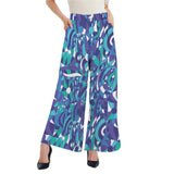 Kume wide leg high rise pants with a vibrant geometric print in shades of blue and green. The pants feature a high rise waist and a flowy, wide leg silhouette. Retro Chic Blissfully Brand