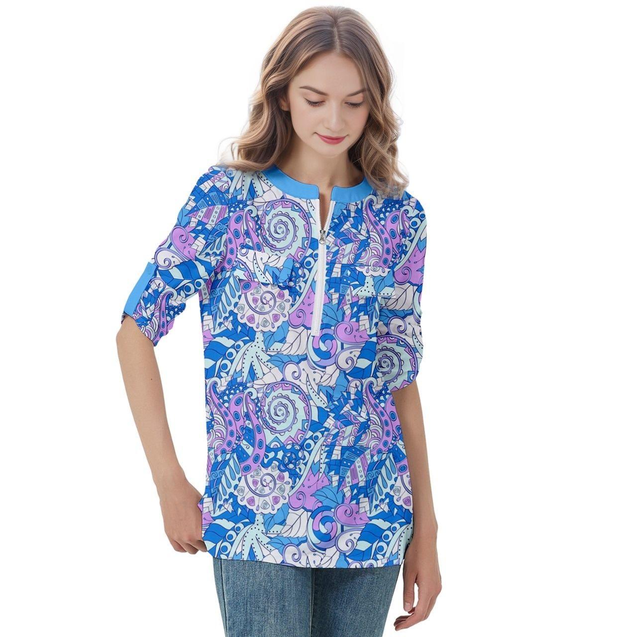 Vibrant blue and pink abstract print women's top with a stylish zipper detail and 3/4 sleeves - perfect for a trendy and colorful casual look, paired with jeans. Ideal for adding a pop of color and artistic flair to your wardrobe. Shop now for unique, eye-catching women's fashion