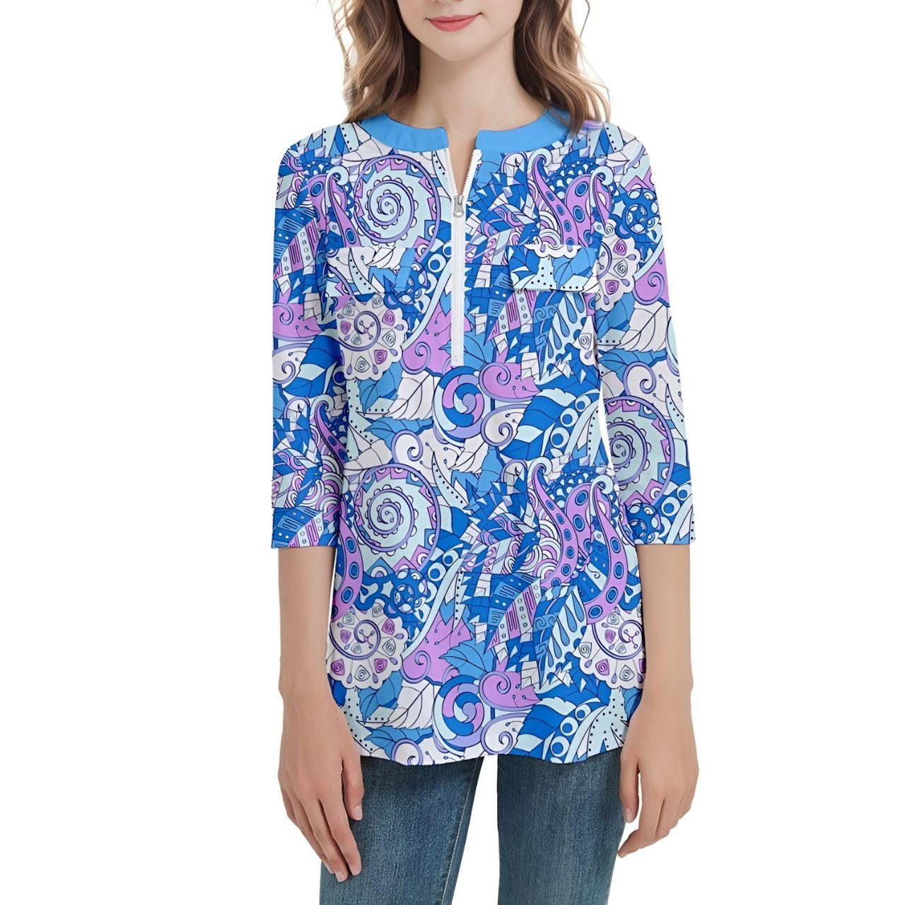 Vibrant paisley print tunic top in blue and purple tones, featuring 3/4 sleeves and zip front