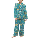  stylish teal blue robe set with a unique and vibrant floral print. The robe set features a long-sleeved top with a tie closure and matching wide-leg pants. Perfect for lounging at home or relaxing Blissfully Brand