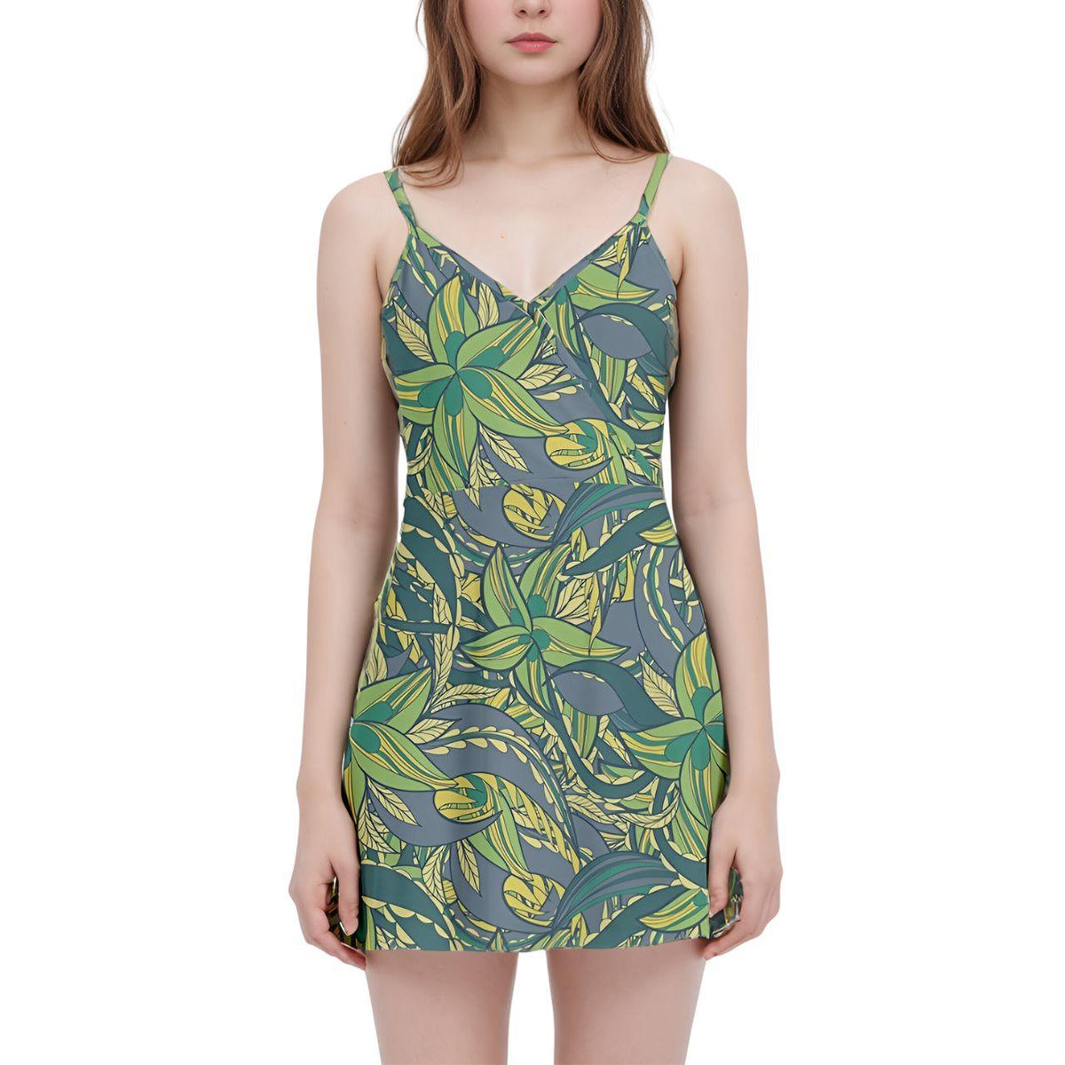  sleeveless green floral dress with a v-neckline and a flowy, A-line silhouette. The dress features a vibrant tropical print of leaves and flowers.