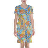 Colorful floral print sleep dress with short sleeves and knee-length cut, featuring a vibrant pattern in blue, yellow, and orange on a comfortable, flowing silhouette.