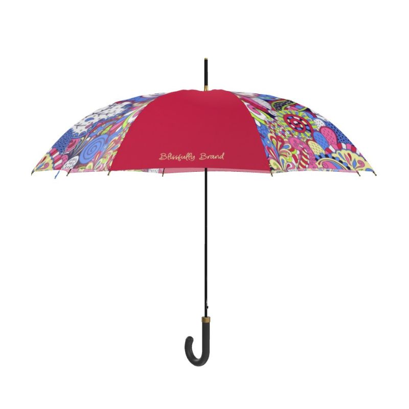 Sechia series handmade classic crook handle umbrella showcasing its vibrant paisley-inspired design in pink, red, and blue hues. Auto open full size canopy. Retro Psychedelic - Made in England - Blissfully Brand